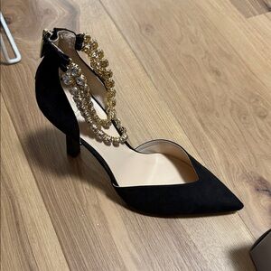Jennifer Lopez Black Heels with Gold Embellishments